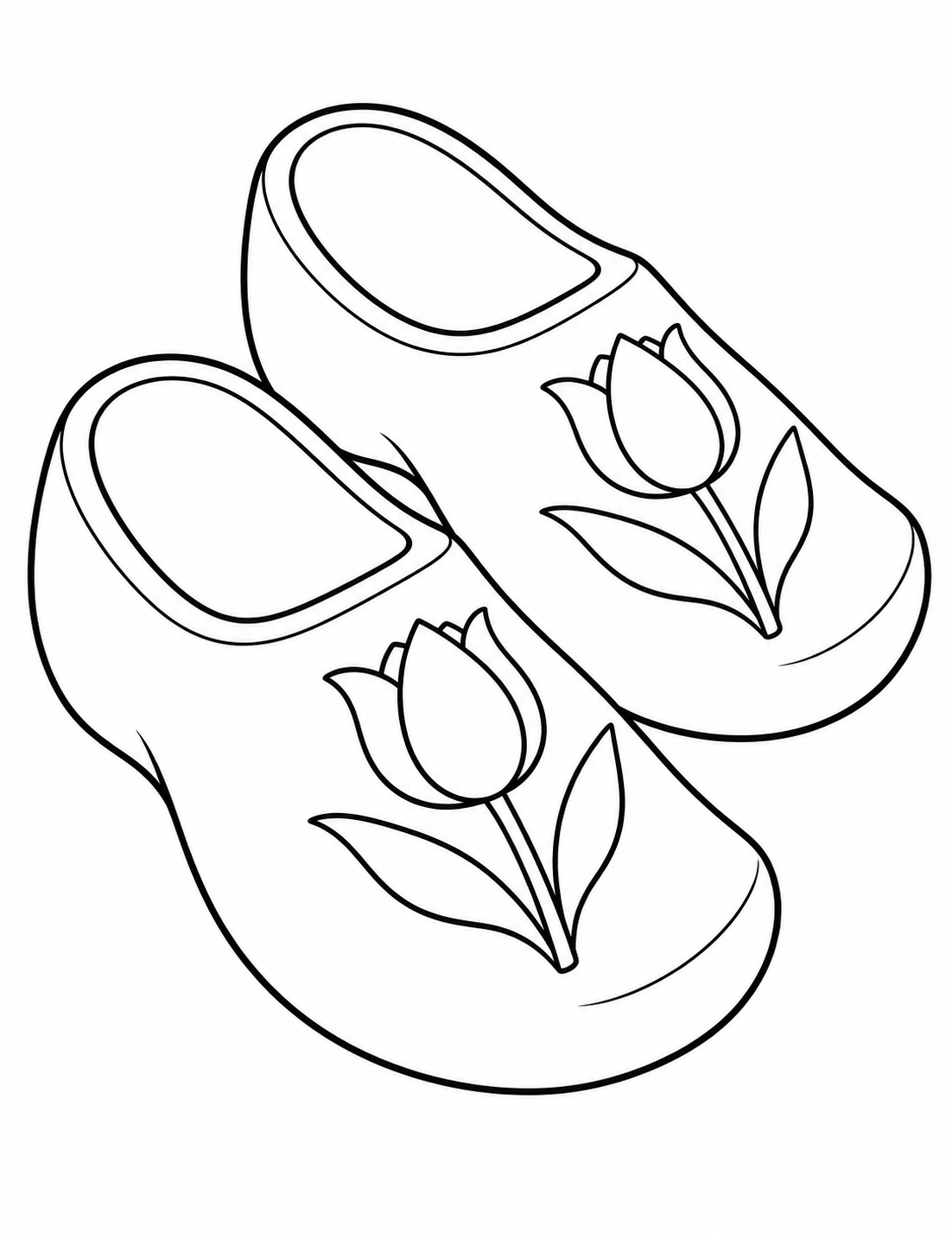 Two large wooden clogs sit diagonally side by side, each decorated with a matching tulip motif.